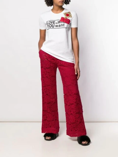 Shop Dolce & Gabbana Floral Lace Wide Trousers In Red