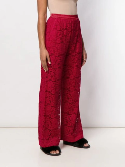 Shop Dolce & Gabbana Floral Lace Wide Trousers In Red