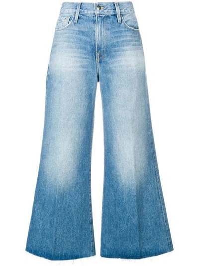 Shop Frame Wide Leg Flared Jeans In Blue