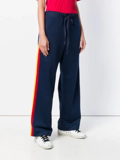 Shop À La Garçonne Side Stripe Track Trousers In Blue