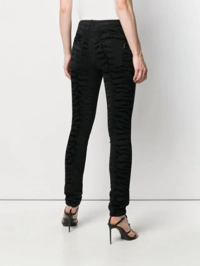 Shop Saint Laurent Zebra Print Jeans In Black