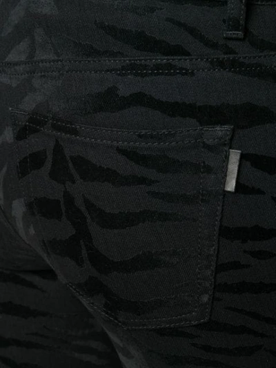 Shop Saint Laurent Zebra Print Jeans In Black