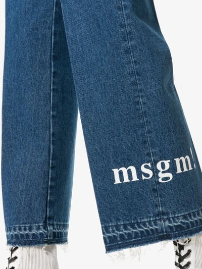 Shop Msgm Cropped Logo Jeans In Blue
