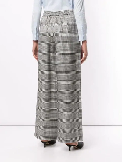 Shop Layeur Check Print Trousers In Grey