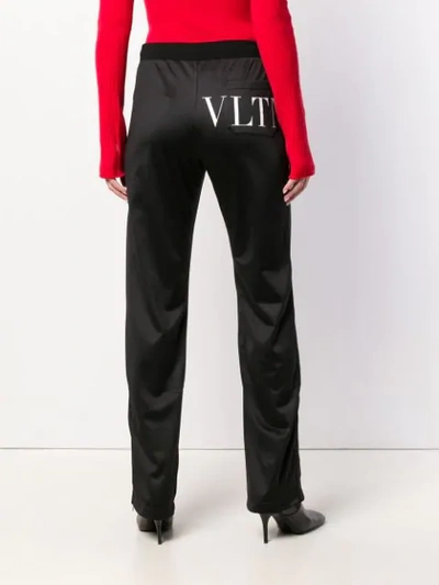 Shop Valentino Vltn Track Pants In Black