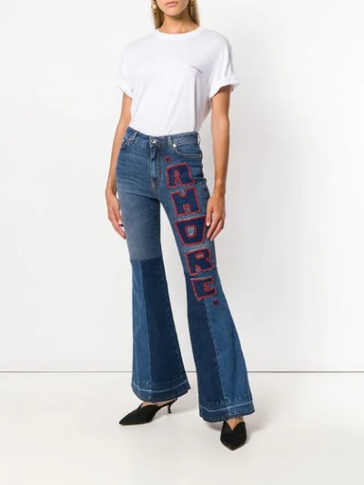 Shop Dolce & Gabbana Flared Amore Jeans In Blue