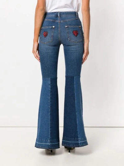 Shop Dolce & Gabbana Flared Amore Jeans In Blue