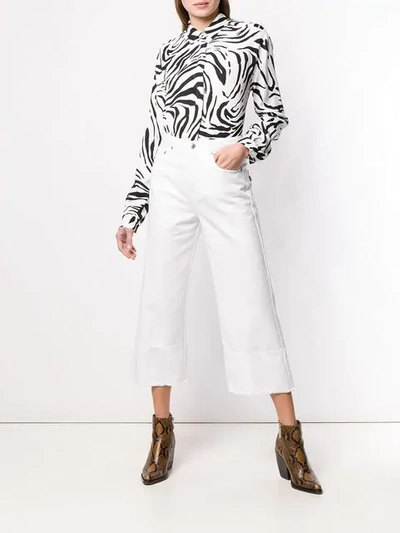 Shop Msgm Cropped Wide-leg Jeans In White