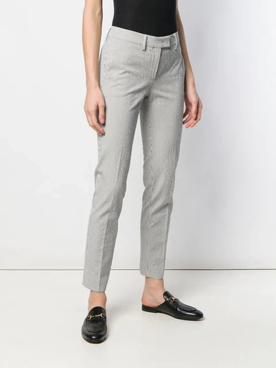 Shop Incotex Striped Tapered Trousers In White