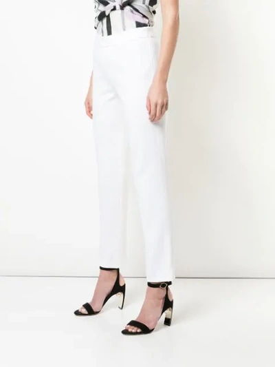 Shop Josie Natori Slim Fit Jeans In White