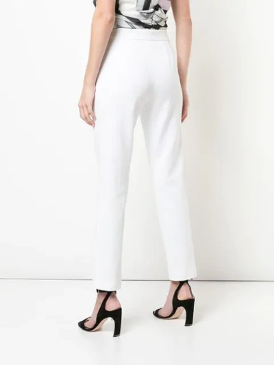 Shop Josie Natori Slim Fit Jeans In White