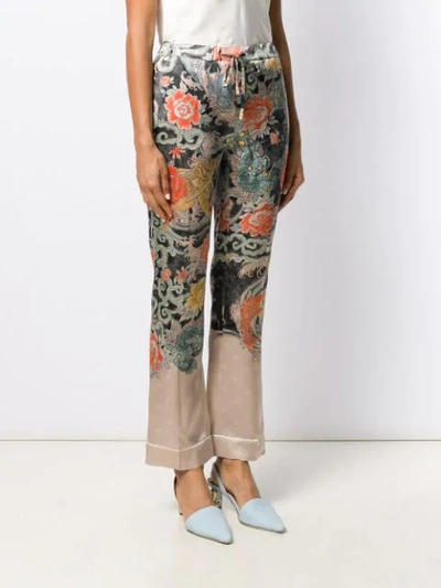 Shop Valentino Printed Silk Flared Trousers In Black