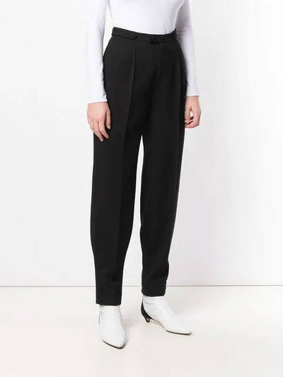 Shop Givenchy Tailored Button Detailed Trousers In Black