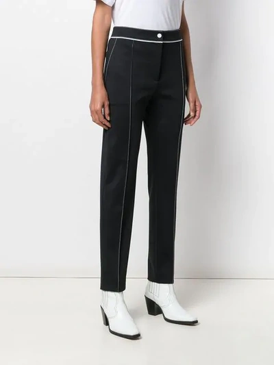 Shop Valentino Vltn Print Trousers In Black