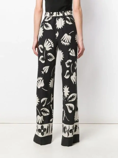 Shop Etro Floral Print Wide Leg Trousers In Black