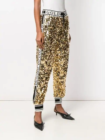 Shop Dolce & Gabbana Side Band Sequin Trousers In Gold