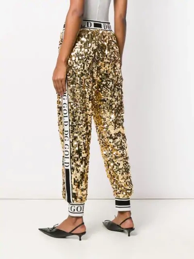 Shop Dolce & Gabbana Side Band Sequin Trousers In Gold