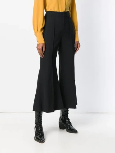 Shop Chloé Flared Cropped Trousers In Black