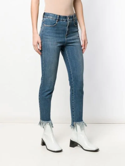 Shop Stella Mccartney Eyewear Fringed Cuff Cropped Jeans - Blue