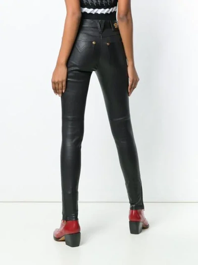 Shop Versace Skinny Trousers In A1008 Nero