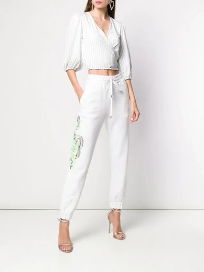 Shop Pinko Snake Print Track Pants In White