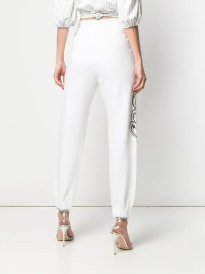 Shop Pinko Snake Print Track Pants In White
