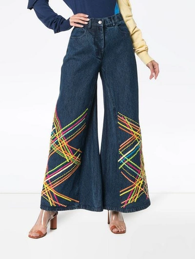 Shop All Things Mochi Brianna Embroidered Flared Jeans In Blue