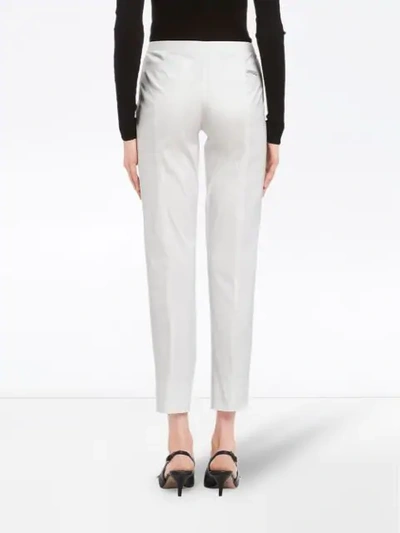 Shop Prada Slim-fit Trousers In White