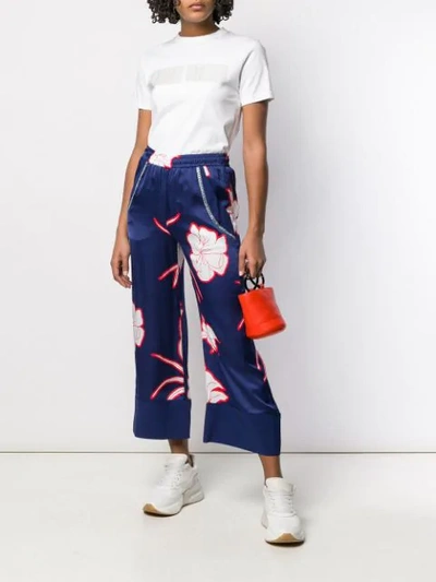 Shop Pinko Flower Print Flare Trousers In Blue