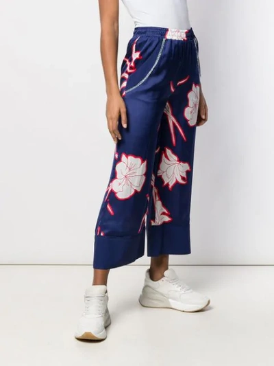 Shop Pinko Flower Print Flare Trousers In Blue