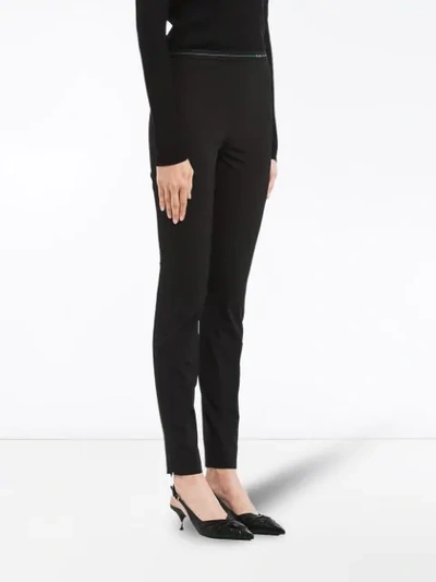 Shop Prada Technical Fabric Trousers In Black