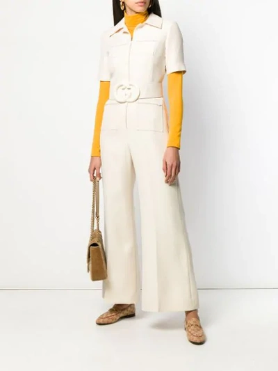 Shop Gucci Gg Logo Belted Jumpsuit In Neutrals