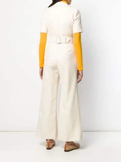 Shop Gucci Gg Logo Belted Jumpsuit In Neutrals