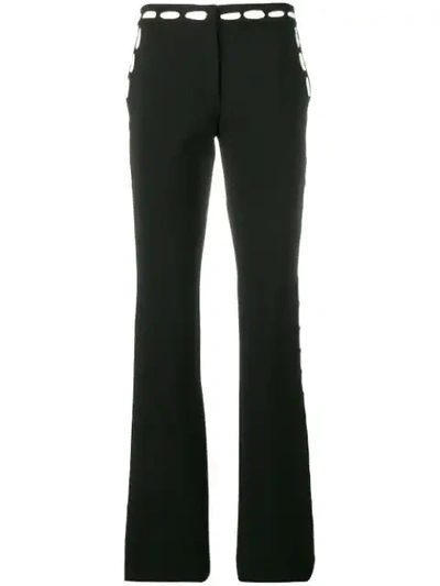 Shop Moschino Contrast Print Trousers In Black
