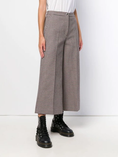 Shop Msgm Dogtooth Cropped Trousers In Red