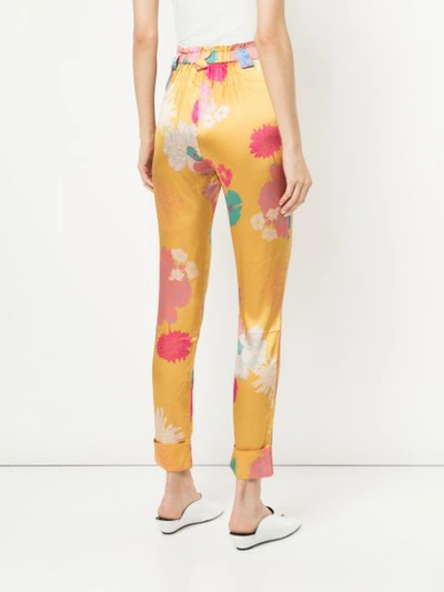 Shop Stine Goya Floral Print Trousers In Multicolour