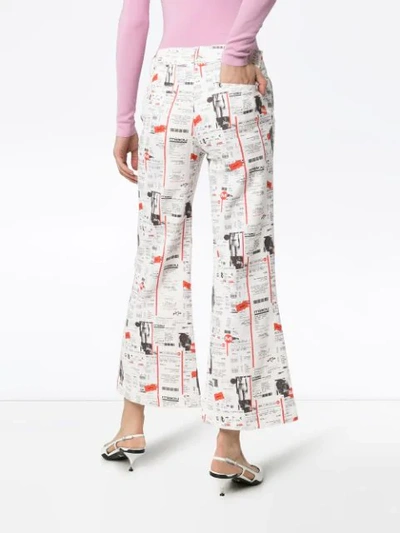 Shop Miaou Soni Newsprint Flared Jeans In White