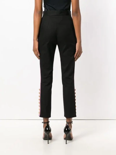 button embellished trousers