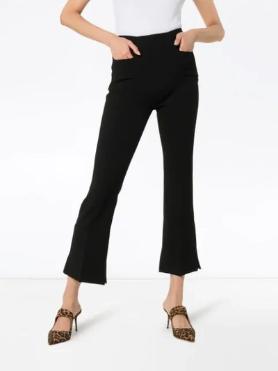 Shop Roland Mouret Goswell Flared Split-hem Trousers In Black