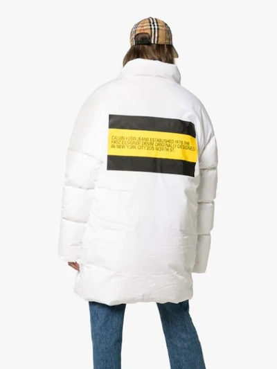 Shop Calvin Klein Jeans Est.1978 Logo Stripe Print Goose And Feather Down Puffer Jacket In White