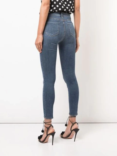 Shop L Agence Skinny Cropped Stonewashed Jeans In Blue