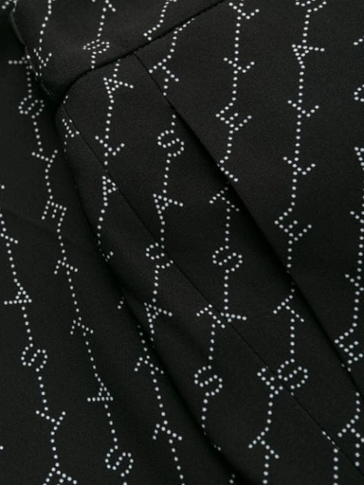Shop Stella Mccartney Julia Monogram Loose Fit Trousers In Black