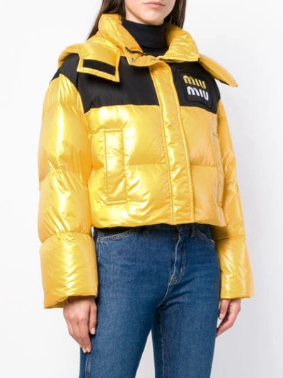 Shop Miu Miu Cropped Puffer Jacket - Yellow