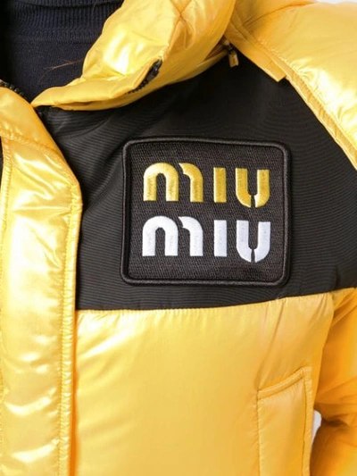 Shop Miu Miu Cropped Puffer Jacket - Yellow