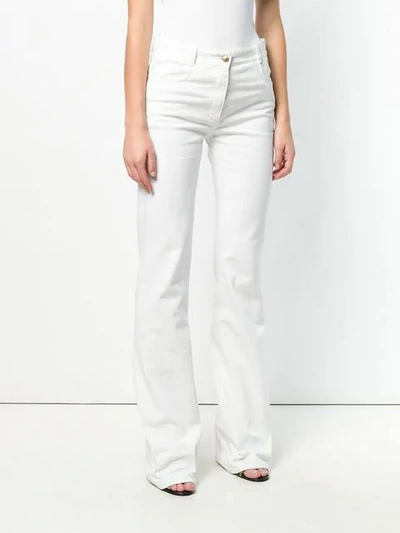 Shop Nina Ricci Bootcut Jeans In White