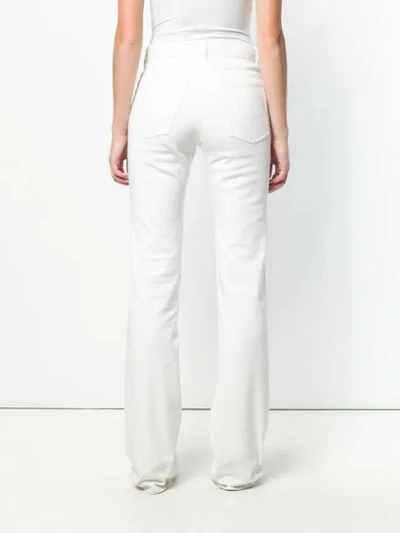 Shop Nina Ricci Bootcut Jeans In White