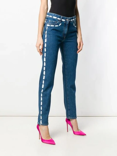 Shop Moschino Painted Stitch Jeans In 3288