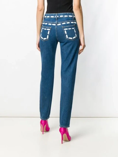 Shop Moschino Painted Stitch Jeans In 3288