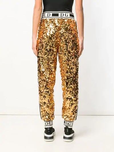 Shop Dolce & Gabbana Logo Sequinned Track Pants In Gold