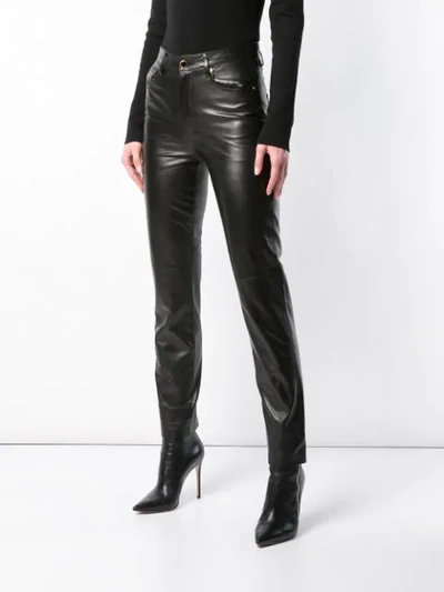 Shop Khaite Slim-fit Trousers In Black